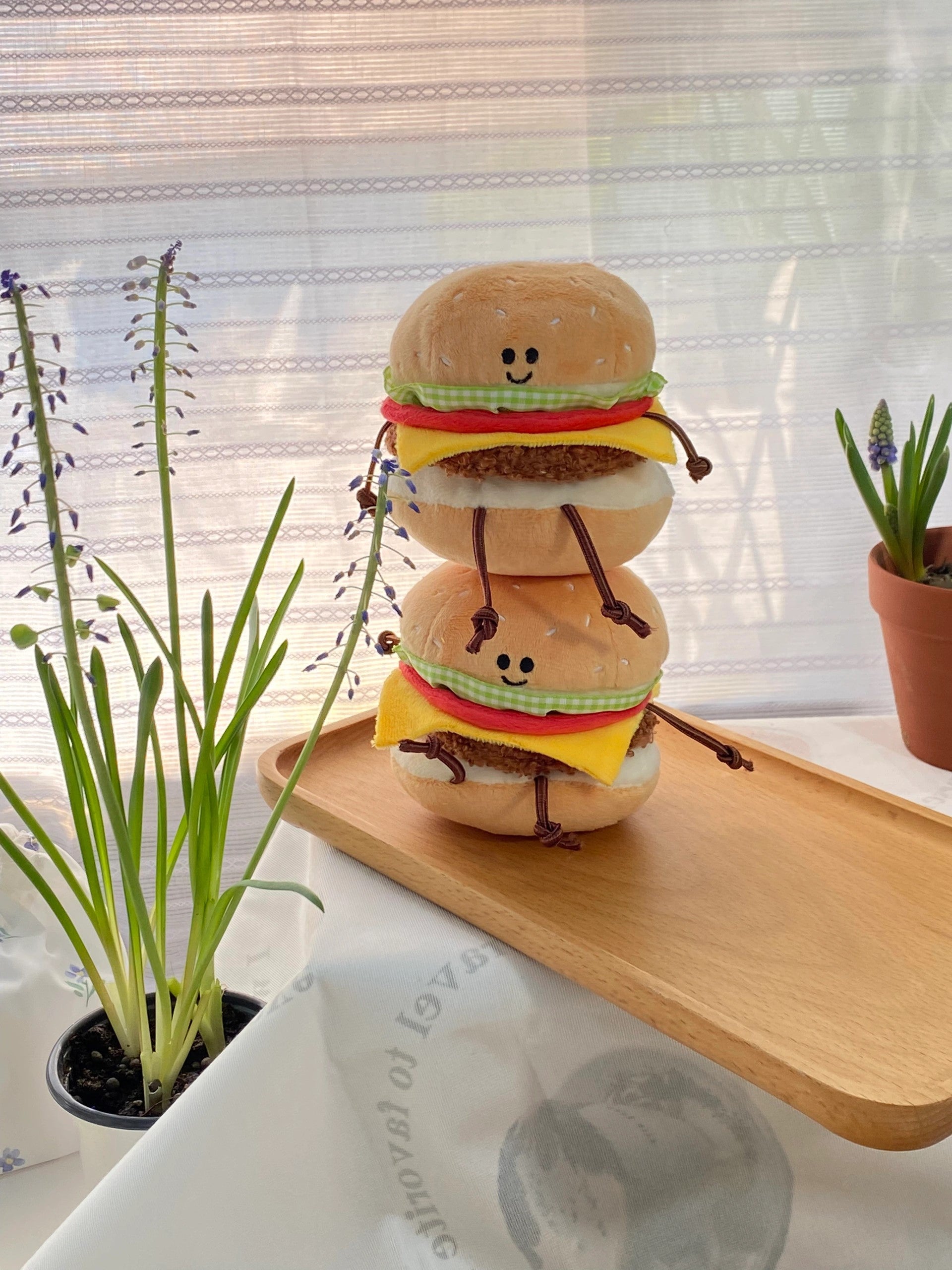 Embroidered smiling burger plush face