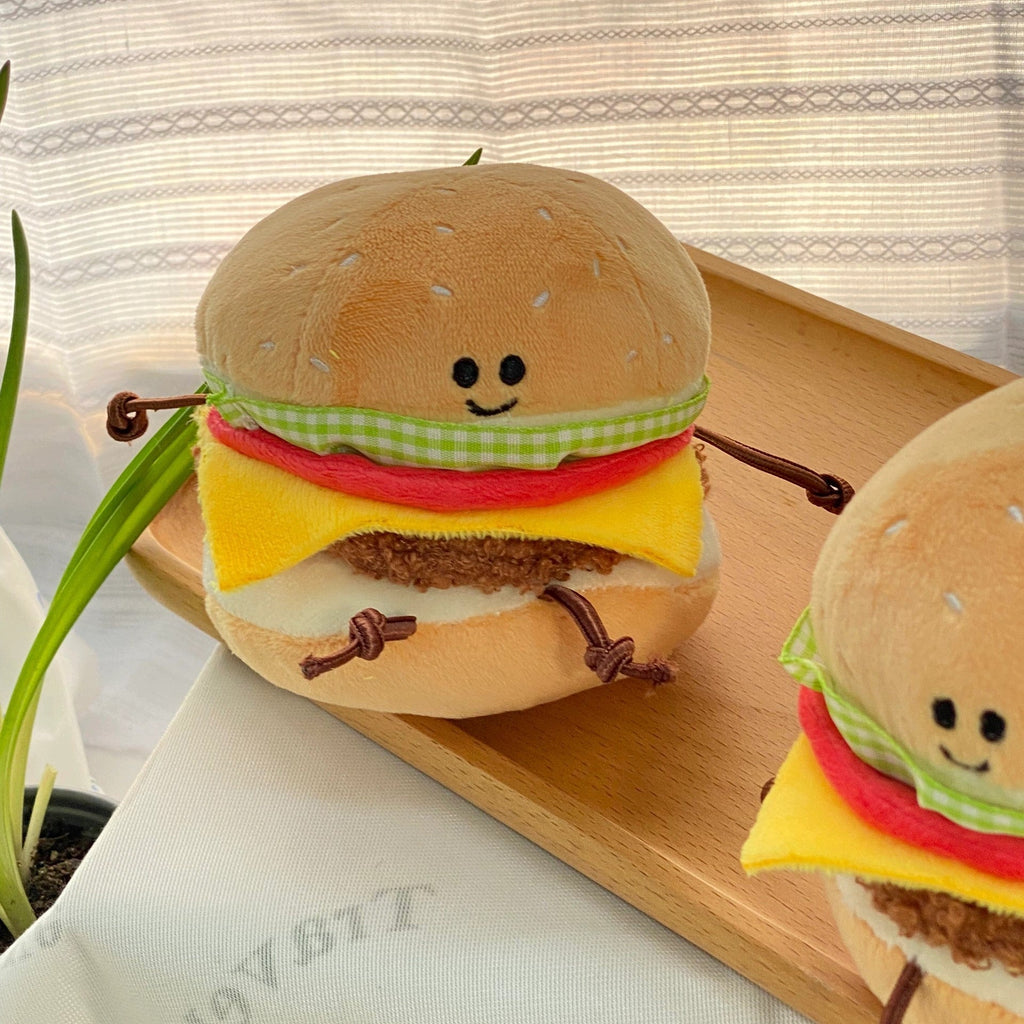 Soft burger toy with dangling plush legs