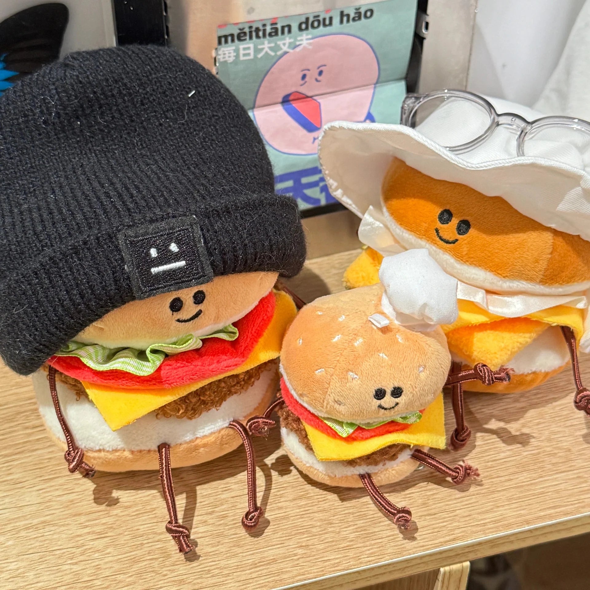 Plush burger toy with dangling knotted legs