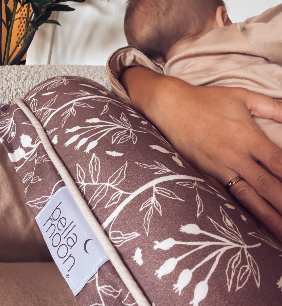 Nursing pillow providing newborn feeding support