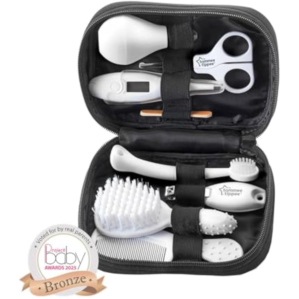 Baby grooming kit includes thermometer, nail clippers, brush, comb, toothbrush, and nail files